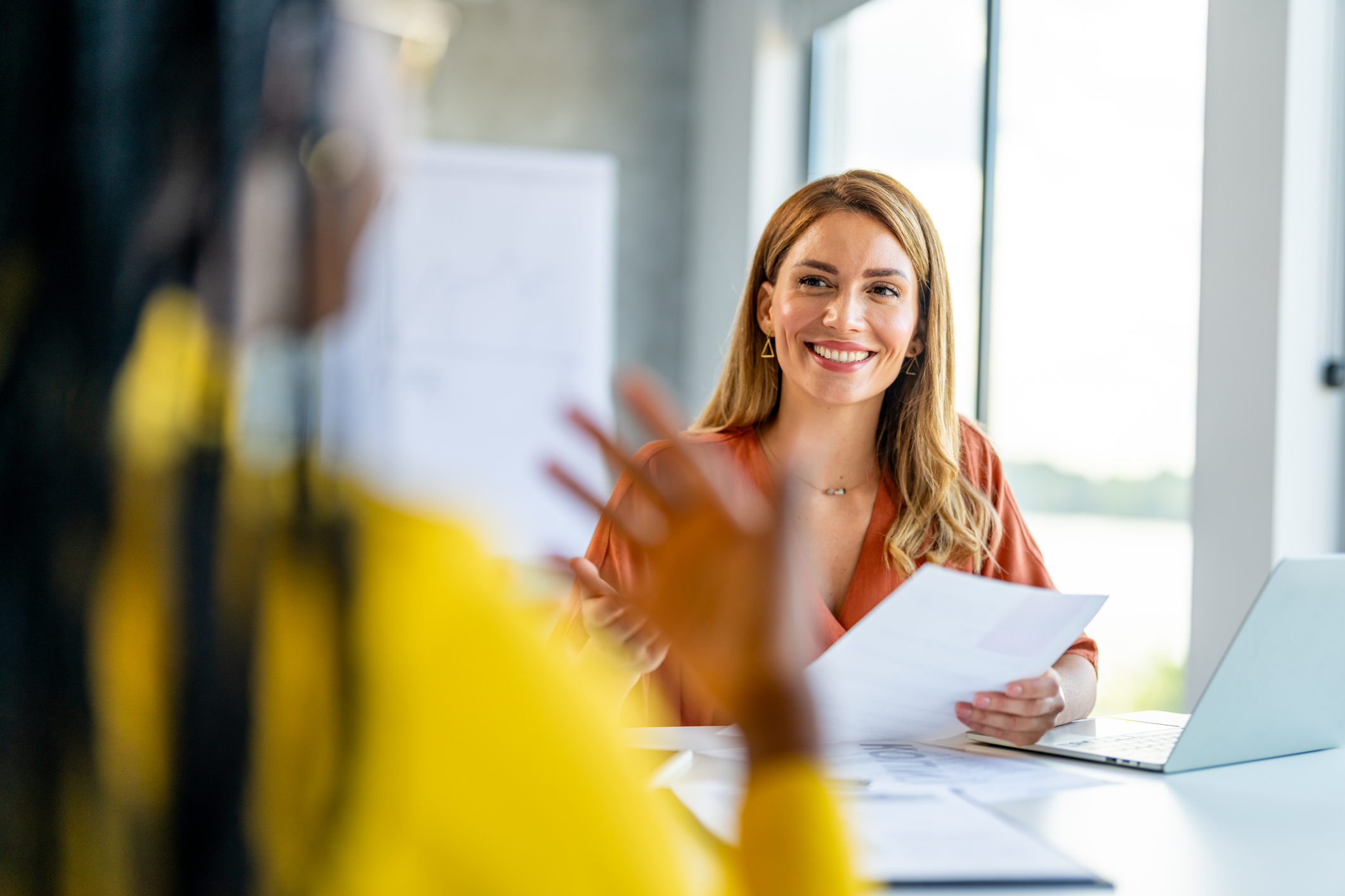 Women interacting in office setting